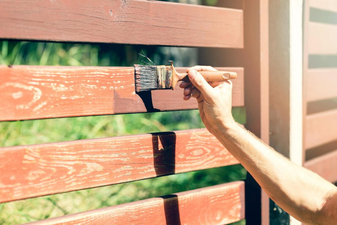 old fence being painted
